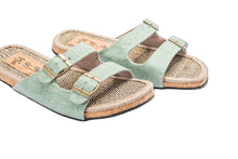 Load image into Gallery viewer, Pair of green sandals with cork sole on a white background