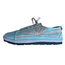 Load image into Gallery viewer, Green hemp sneaker with a sunburst design on a wooden surface
